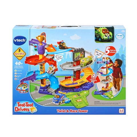 Image of the Vtech Toot-Toot Drivers Twist & Race Tower packaging. The box displays a multi-level spiral track featuring colorful toy vehicles and characters, including a SmartPoint race car. It highlights features such as 5 SmartPoint locations, 2 track variations, and interactive lights and sounds. Suitable for ages 1-5.