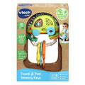 The VTech Touch & Feel Sensory Keys toy by Vtech comes in packaging that showcases its vibrant sensory keys, tailored for ages 3 to 18 months. This baby car key toy features over 40 songs and sounds and is crafted from plant-based plastic to promote fine motor skills and color recognition. The box also displays a happy baby joyfully playing with it.