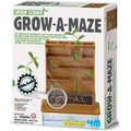 The image shows the packaging for a children's science kit called "4M Green Science Kit - Grow a Maze." The box features a plant maze and a root watcher grow chamber, allowing kids to observe a plant finding its way to the top. The kit is by 4M and includes educational content about plant growth.