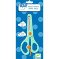 A pair of Djeco Scissors, designed specifically for children by DJECO, comes with mint-green handles, plastic tips, and an orange button. These safety scissors are packaged on a blue cardboard backing adorned with polka dots. The packaging features logos and multilingual text indicating the suitable age range of 3–6 years and highlights features such as "easy to open" and "secure safe.