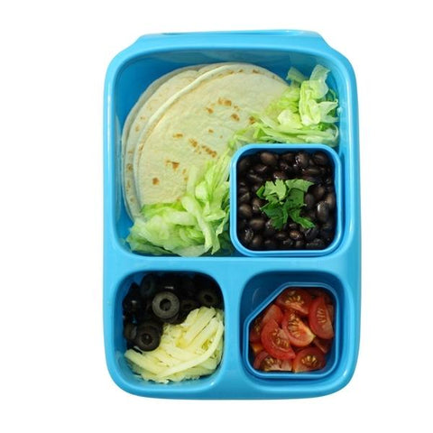 The Goodbyn Hero (with Dipper Set) from Goodbyn in blue features separate compartments for tortillas, shredded lettuce, black beans garnished with cilantro, sliced cherry tomatoes, and a mixture of shredded cheese and black olives. Each type of food is kept fresh and safe from BPA exposure within the divided sections for a delightful lunch experience.