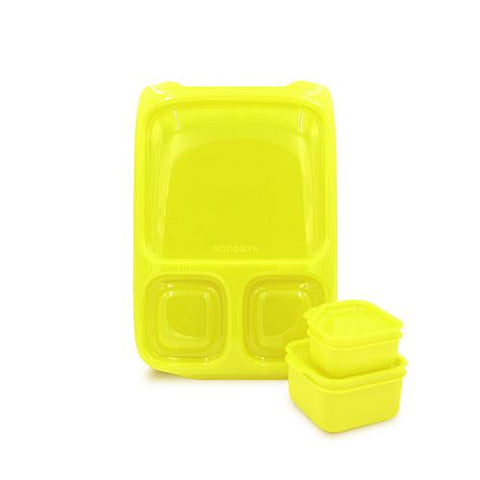 The bright yellow, BPA-free Goodbyn Hero with Dipper Set is styled as a three-compartment bento and includes two additional small, square containers stacked beside it. The main Goodbyn Hero container features one large section and two smaller sections for meal organization and portion control.