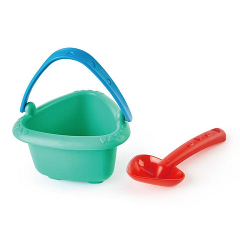 The HAPE Baby Bucket & Spade set by HAPE includes a green, triangular-shaped beach bucket with a blue handle and a red scoop. Made of durable plastic, both pieces are perfect for playing in the sand. The bucket features a textured rim with decorative patterns, making it an ideal first playset for beach fun.