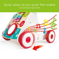 The HAPE My First Musical Walker by HAPE is a vibrant walker crafted for early walking, featuring red and white wheels. It includes a musical panel adorned with various instrument depictions, such as a xylophone. The caption reads, "Music plays as you push the walker (No batteries required!)," accompanied by colorful music notes illustrations and adjustable speeds.