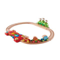 The Hape Music and Monkeys Railway by Hape is a colorful wooden toy train set that includes a circular track, a red and yellow train engine, two green and blue cars featuring lion and elephant figures, a musical xylophone bridge, and a hilly area with three playful monkey figures. This animal adventure promises endless fun for young explorers.