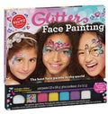 A vibrant box of face painting supplies labeled "Klutz Glitter Face Painting" by KLUTZ. The package features three smiling children adorned with glittery face paint designs and playful body stickers. The kit includes a palette of six paint colors and a compartment labeled "Glitter and Rhinestones," making it perfect for honing your face-painting skills!