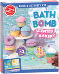 The image features the cover of "Klutz Make Your Own Bath Bombs Scented Bakery," a book and activity kit by KLUTZ. Showcasing colorful, bakery-themed bath bombs in shapes like cupcakes and macarons, this gift box includes materials for crafting up to 12 baking soda bath bombs and an instructional book.