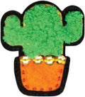 A vibrant and artistic patch featuring a cactus crafted from fuzzy green material, placed in a vivid orange pot embellished with golden sequins along the top edge, echoing designs reminiscent of kids embroidery. This patch is part of the Klutz Make Your Own Stick on Patches collection by KLUTZ and is framed with a black border.