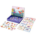 The MIEREDU Magnetic Art Case - Dino World by MIEREDU is a children's educational toy set that features magnetic dinosaur pieces and matching cards displayed on a flat surface. The open box with compartments houses various colorful dinosaur magnets, designed to develop fine motor skills, while the background showcases a vibrant prehistoric scene with mountains and birds.