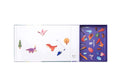 The MIEREDU Magnetic Art Case - Dino World by MIEREDU offers an engaging children's educational set that includes a whiteboard with magnetic pieces such as a tree, dinosaur, and bird. A dry-erase marker is conveniently placed on the whiteboard. Designed to stimulate imagination and enhance fine motor skills, the colorful magnetic pieces are neatly organized in a purple compartment on the right side.