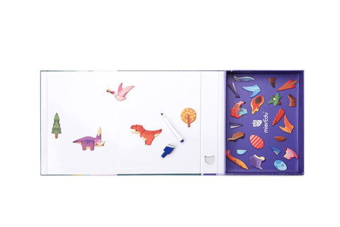 The MIEREDU Magnetic Art Case - Dino World by MIEREDU offers an engaging children's educational set that includes a whiteboard with magnetic pieces such as a tree, dinosaur, and bird. A dry-erase marker is conveniently placed on the whiteboard. Designed to stimulate imagination and enhance fine motor skills, the colorful magnetic pieces are neatly organized in a purple compartment on the right side.