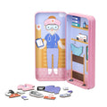 The MIEREDU Travel Magnetic Puzzle Box - Dream Big Series Health Professional by MIEREDU features a magnetic dress-up toy of a Health Professional in a pink and blue uniform. Inside the box, various magnetic pieces are laid out, including medical tools and accessories. The nurse has a stethoscope, and both sides of the box are adorned with health-related illustrations.