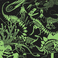 The Mudpuppy 500-piece Illuminated Glow in the Dark Puzzle - Dinosaurs by Mudpuppy features a whimsical green illustration on a black background with various dinosaur skeletons, a falling comet, erupting volcanoes, plants, and stars. This captivating puzzle showcases detailed skeletal structures and natural elements to create a lively prehistoric scene, making it perfect for a family activity.