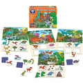 The Orchard Toys Dinosaur Lotto Game, a vibrant and engaging board game from Orchard Toys, is displayed. This dinosaur-themed game includes several illustrated boards showcasing a variety of dinosaurs and their habitats, along with small square tiles featuring individual dinosaur images for an enjoyable memory matching experience. The packaging box can also be seen behind the boards.