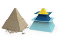 Two objects are shown: on the left, a neatly formed sand pyramid, while on the right, three stacking pyramid molds in yellow, blue, and light blue. The QUUT Pira Stackable Pyramid by QUUT features a click-and-stack design that makes pyramid construction easy and fun for creating impressive architectural sculptures.