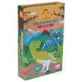 A children's coloring set box with a dinosaur theme, featuring colorful illustrations of various dinosaurs against a backdrop of mountains and jungle scenery. The text reads "Tiger Tribe Colouring Set - Dinosaur" by TIGER TRIBE. It also mentions that markers and stickers are included for portable play.