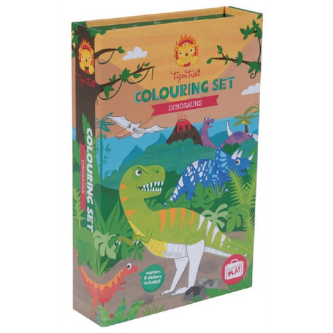 A children's coloring set box with a dinosaur theme, featuring colorful illustrations of various dinosaurs against a backdrop of mountains and jungle scenery. The text reads "Tiger Tribe Colouring Set - Dinosaur" by TIGER TRIBE. It also mentions that markers and stickers are included for portable play.