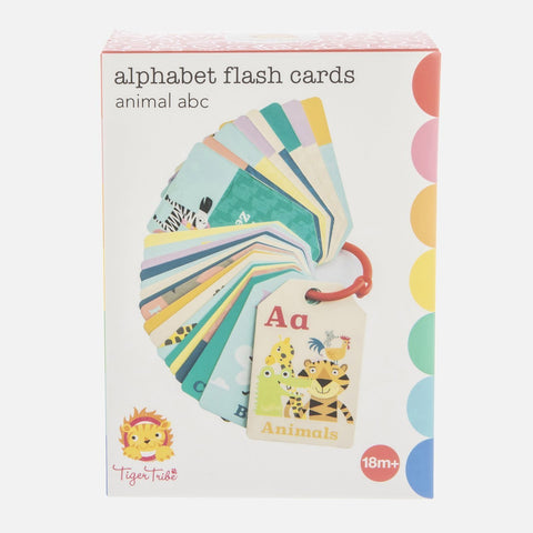 A box of alphabet flash cards titled "Tiger Tribe Flash Cards ABC" by TIGER TRIBE. The box includes a ring of colorful cards featuring various animals and letters, adorned with a lion logo. Suitable for ages 18 months and up, these flash cards are perfect for early vocabulary building.