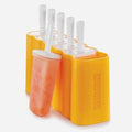 A set of five Zoku Mod Pops from Zoku, featuring BPA-free molds nestled in a vibrant yellow holder. One mold is slightly pulled out, showing a partially melted orange popsicle. The molds come with white handles that have drip guards and stand upright in the holder.